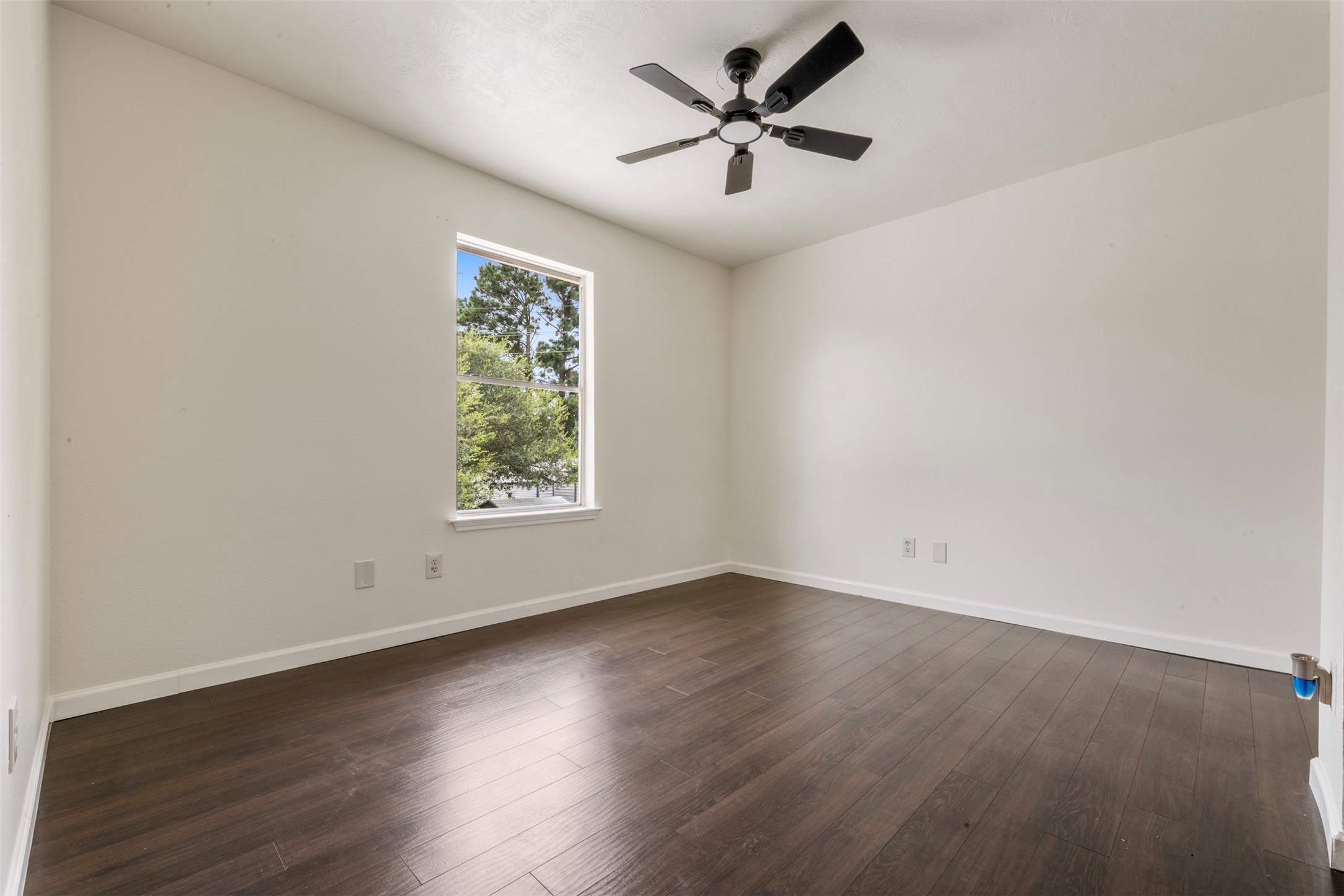 3722 Oaklace Drive Spring, TX 77389 - Photo 25 of 37 an empty room with wooden floor and windows