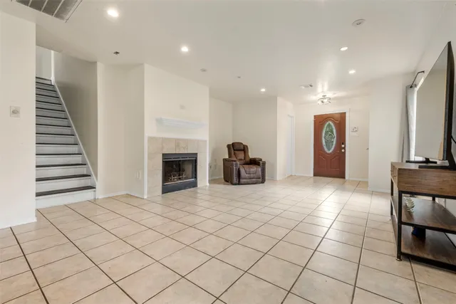 a view of a livingroom with furniture and a fireplace