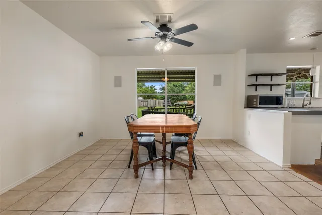 a dining room with furniture and window