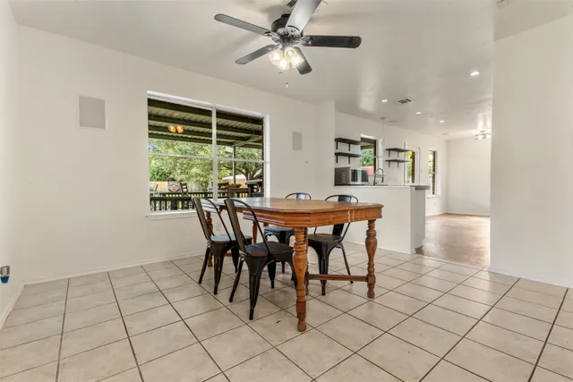 a view of a dining room with furniture window and outside view
