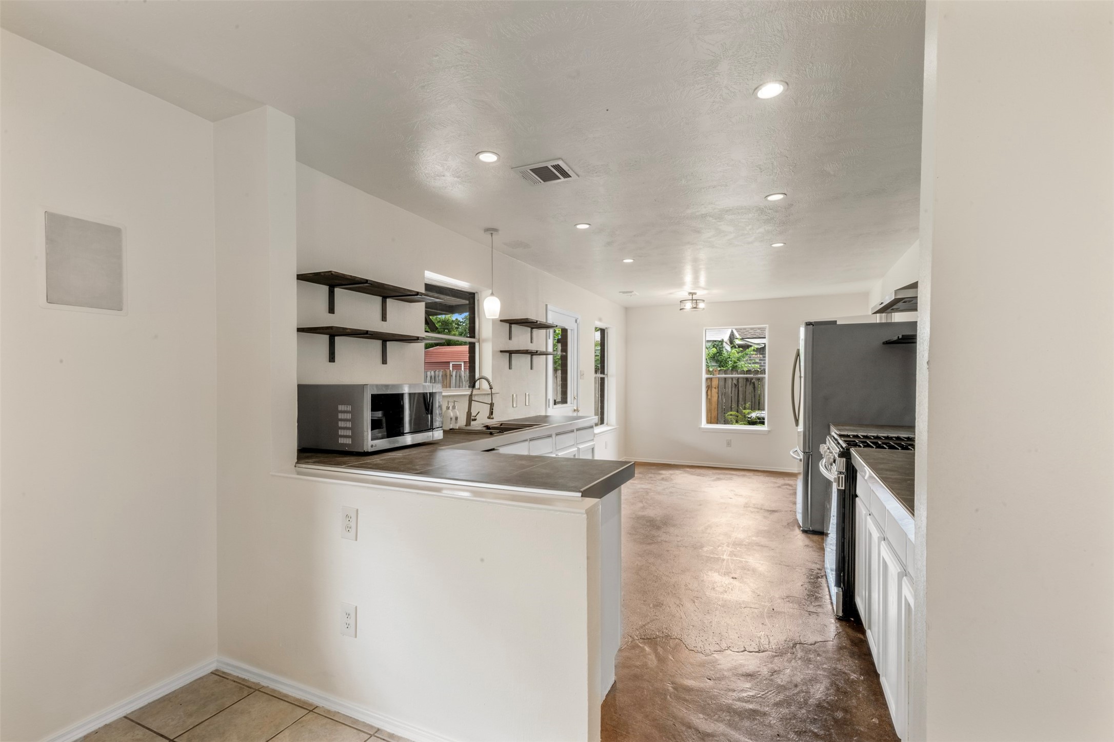 3722 Oaklace Drive Spring, TX 77389 - Photo 10 of 37 a view of a kitchen with a sink and refrigerator