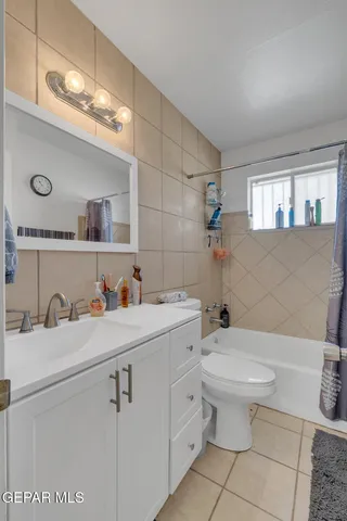a kitchen with a sink cabinets and wooden floor