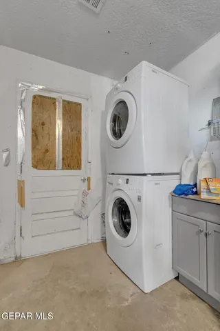 a brick building with a bench in front of it