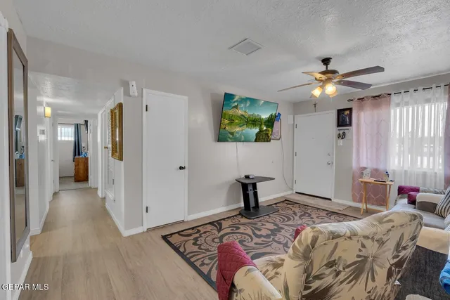 a bedroom with furniture and a chandelier