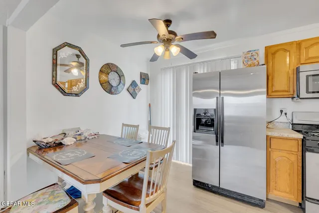 a kitchen with a refrigerator a stove top oven a sink and dishwasher
