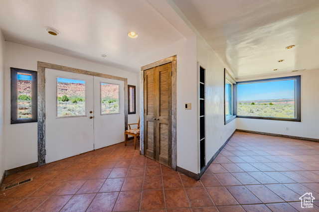 6178 East Zion Road Kanab, UT 84741 - Photo 3 of 48 Foyer entrance with plenty of natural light, recessed lighting, french doors, and dark tile patterned floors