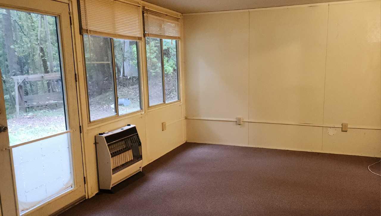 702 Jamestown Road Rocky Mount, VA 24151 - Photo 4 of 10 a view of a room with an empty space and a window