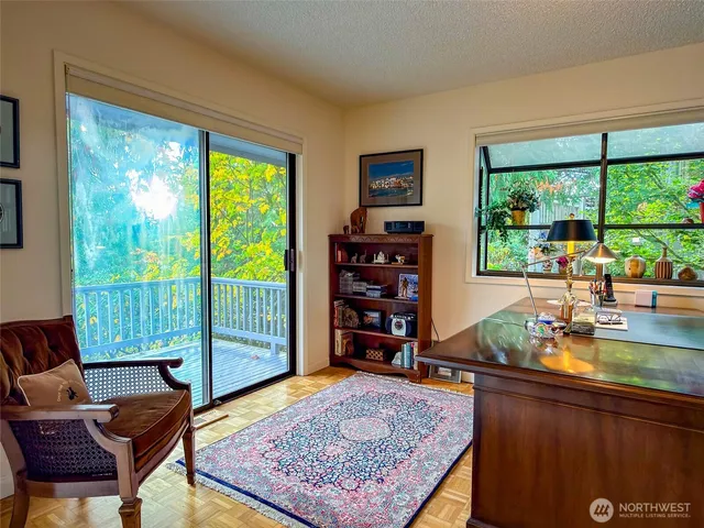a living room with furniture and a rug
