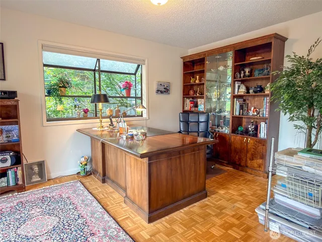 a room with furniture and a rug