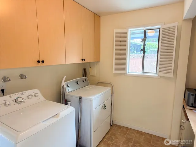 a view of storage and utility room with washer and dryer