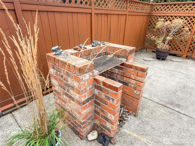 a bedroom with a bed and a curtain