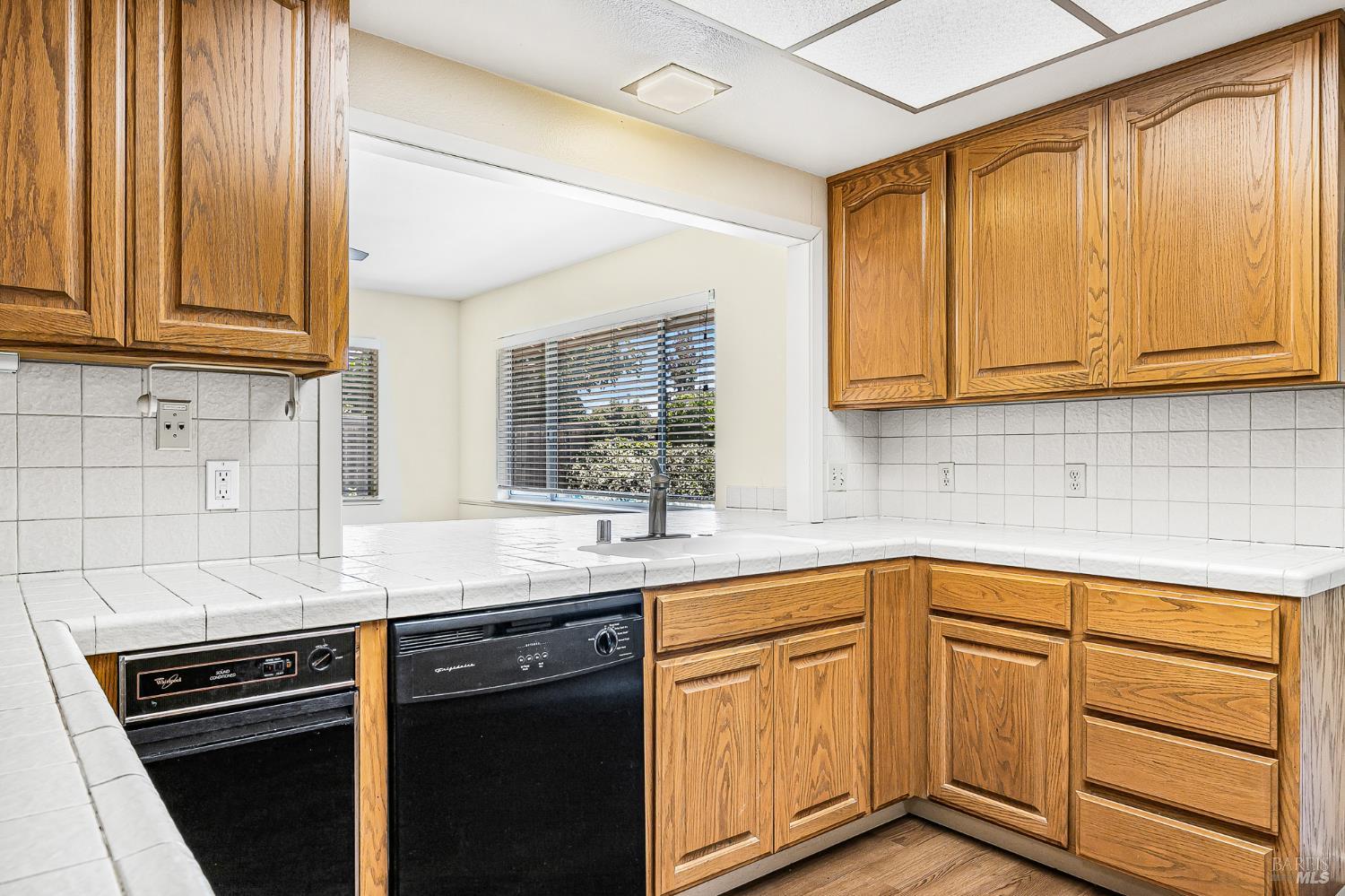 138 Oak Shadow Drive Santa Rosa, CA 95409 - Photo 20 of 50 a kitchen with stainless steel appliances granite countertop a sink stove and cabinets