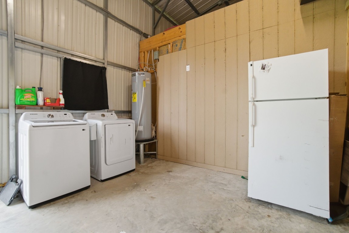 446 Hanson Road Onalaska, TX 77360 - Photo 10 of 27 laundry and extra refrigerator in shop