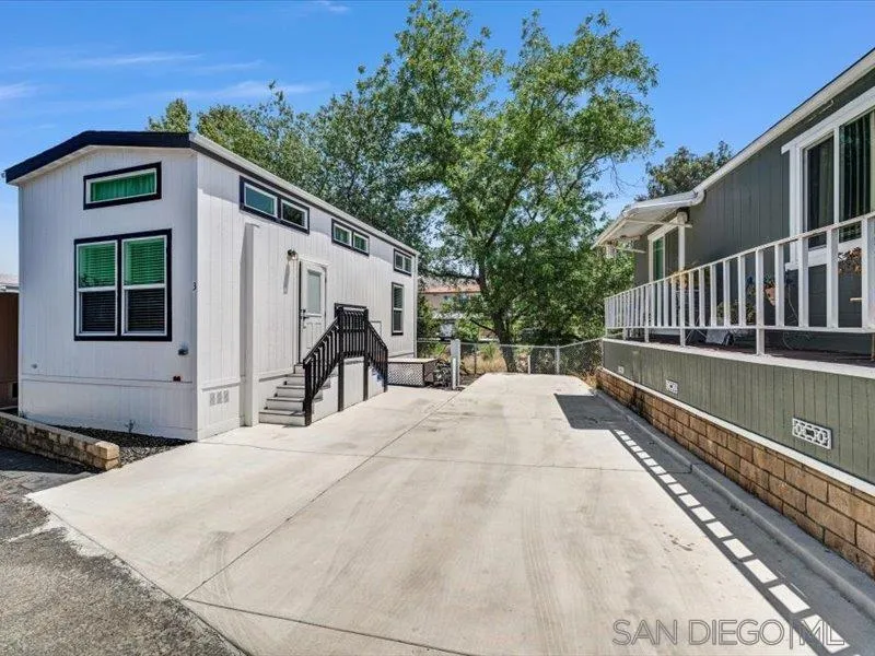 14291 Rios Canyon Road, Unit 3 El Cajon, CA 92021 - Photo 2 of 16 a view of a house with a yard