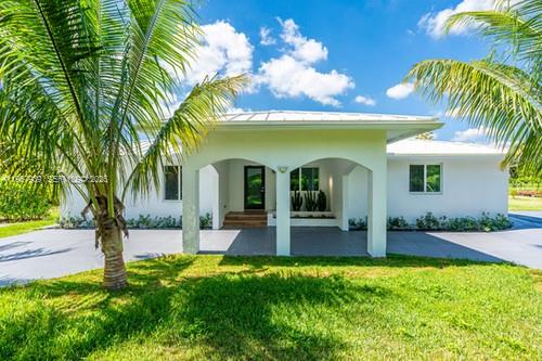 13770 Southwest 192nd Street Miami, FL 33177 - Photo 27 of 28 a view of a house with swimming pool and sitting area