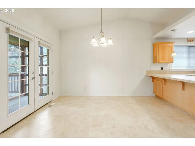 a view of a kitchen with a sink and a cabinet