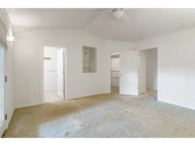 a bathroom with a sink a toilet a mirror and vanity