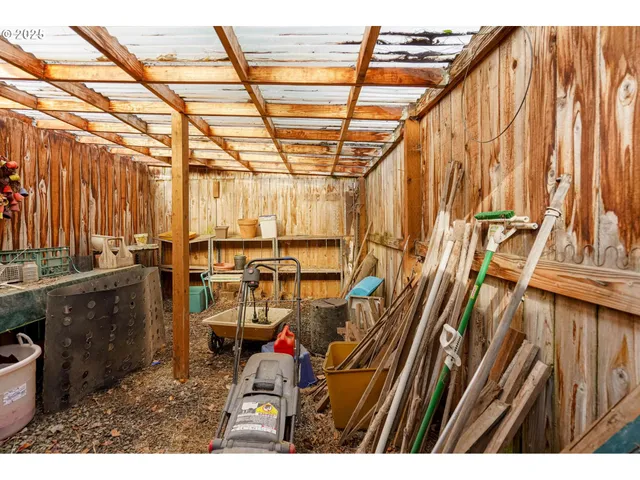 a view of a storage room with a window and storage