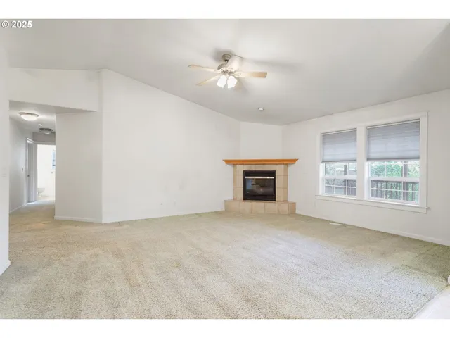 an empty room with windows and entrance