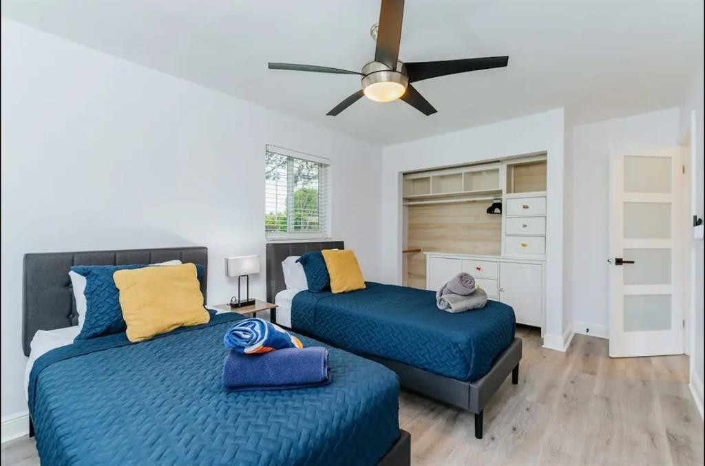 2521 Northeast 51st Street Lighthouse Point, FL 33064 - Photo 17 of 24 a bedroom with furniture and a wooden floor