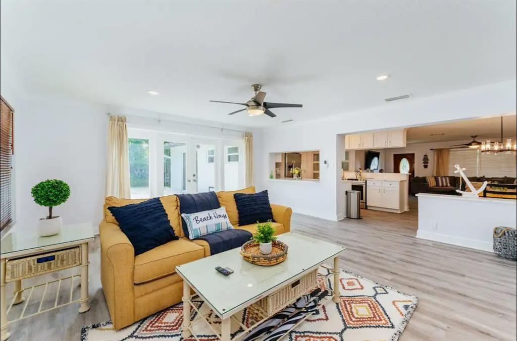 2521 Northeast 51st Street Lighthouse Point, FL 33064 - Photo 6 of 24 a living room with furniture and wooden floor