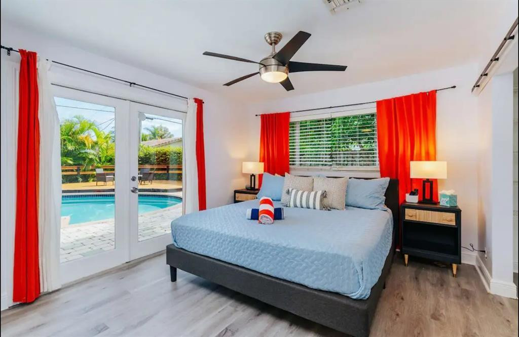 2521 Northeast 51st Street Lighthouse Point, FL 33064 - Photo 9 of 24 a bed room with a bed and a window