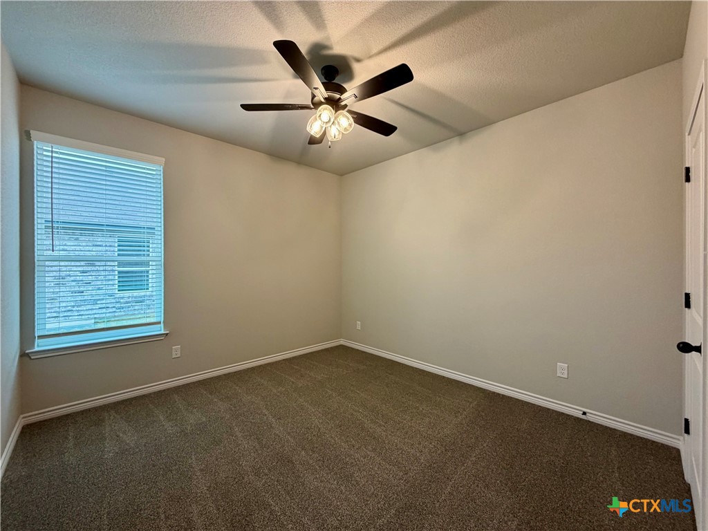 6903 Wizard Drive Killeen, TX 76549 - Photo 19 of 23 an empty room with windows and fan