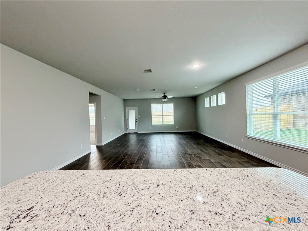 6903 Wizard Drive Killeen, TX 76549 - Photo 7 of 23 a view of a hallway to a window and wooden floor