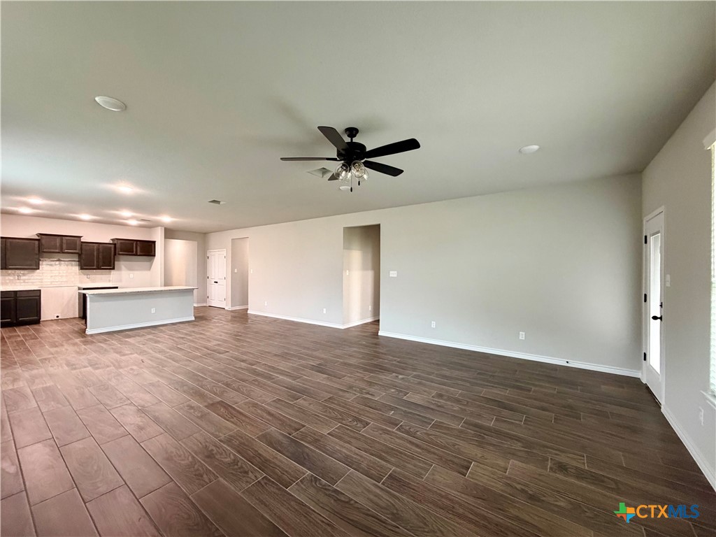 6903 Wizard Drive Killeen, TX 76549 - Photo 8 of 23 a view of a livingroom with a hardwood floor and a ceiling fan