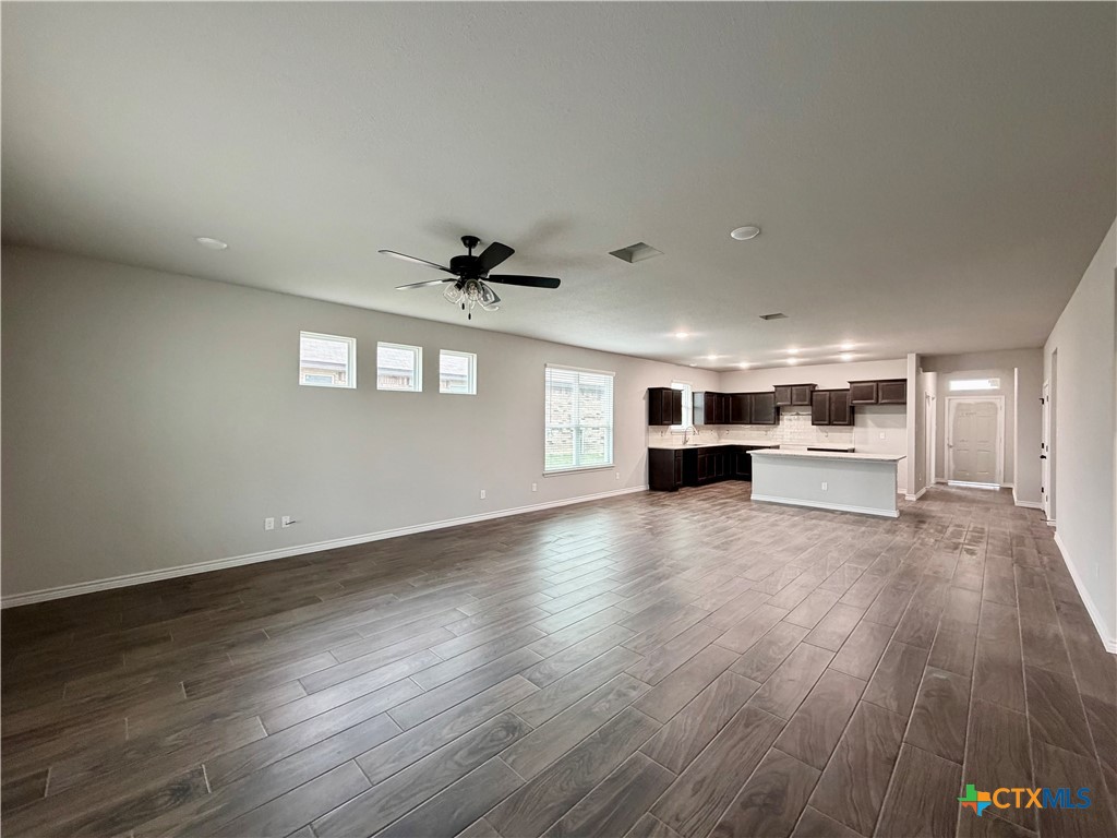 6903 Wizard Drive Killeen, TX 76549 - Photo 9 of 23 a view of empty room with wooden floor and window