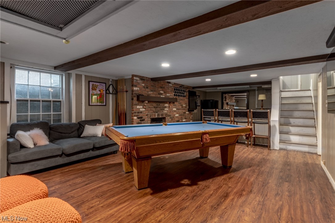2482 Charney Road Cleveland, OH 44118 - Photo 28 of 34 Playroom featuring a brick fireplace, billiards, hardwood floors, and beam ceiling