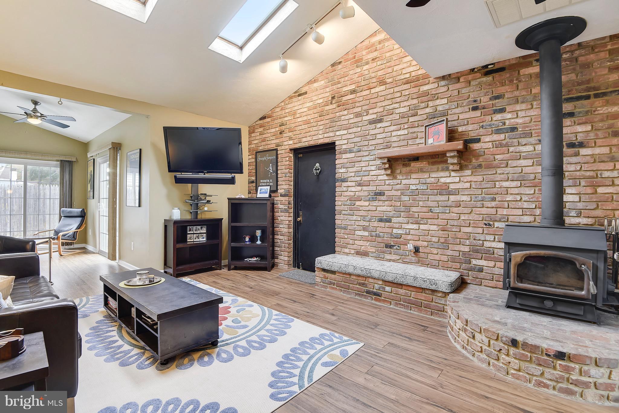 403 Silver Run Road Edgewater, MD 21037 - Photo 16 of 29 Family Room with wall of brick and wood stove