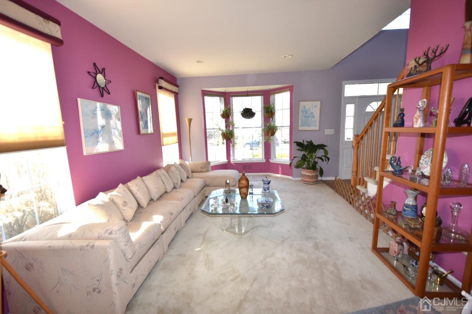 42 Timber Ridge Road North Brunswick, NJ 08902 - Photo 4 of 43 a living room with furniture and a flat screen tv