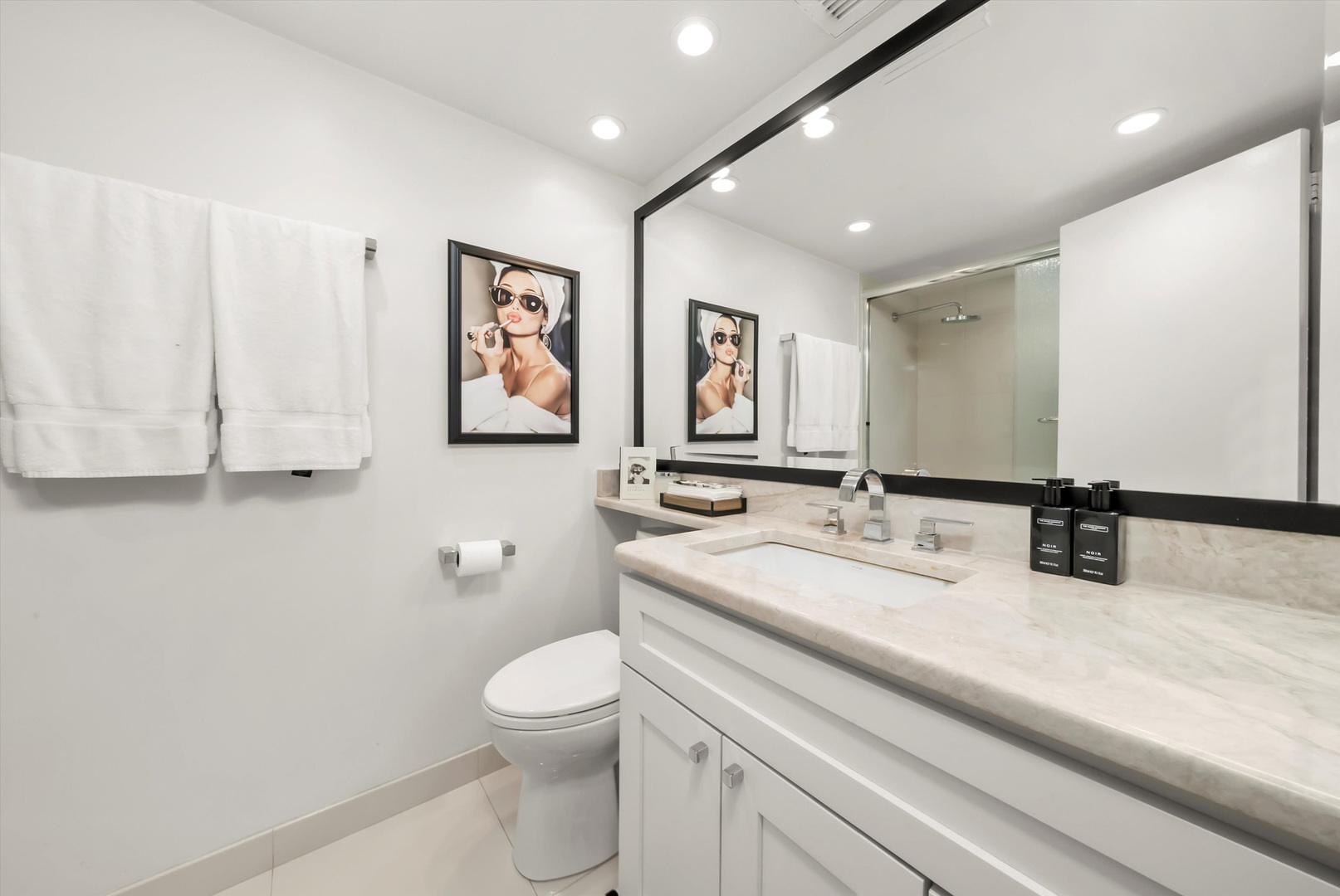 175 East Delaware Place, Unit 7107 Chicago, IL 60611 - Photo 20 of 42 a bathroom with a toilet sink and mirror