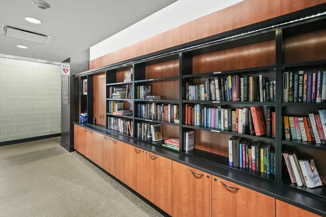 a living room with lots of books