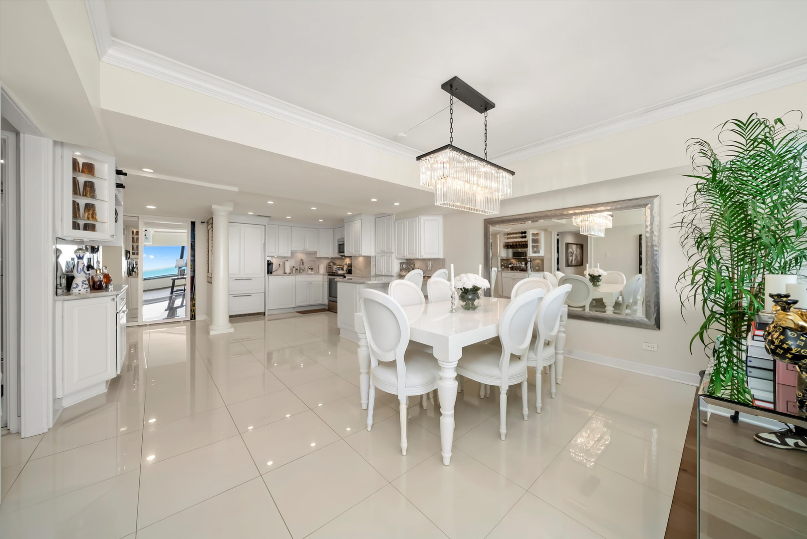 175 East Delaware Place, Unit 7107 Chicago, IL 60611 - Photo 9 of 42 a dining room with furniture a chandelier and a painting