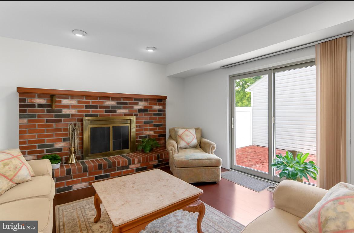 812 Green Ridge Circle Langhorne, PA 19053 - Photo 9 of 36 Wood Burning Fireplace & Sliders to Courtyard