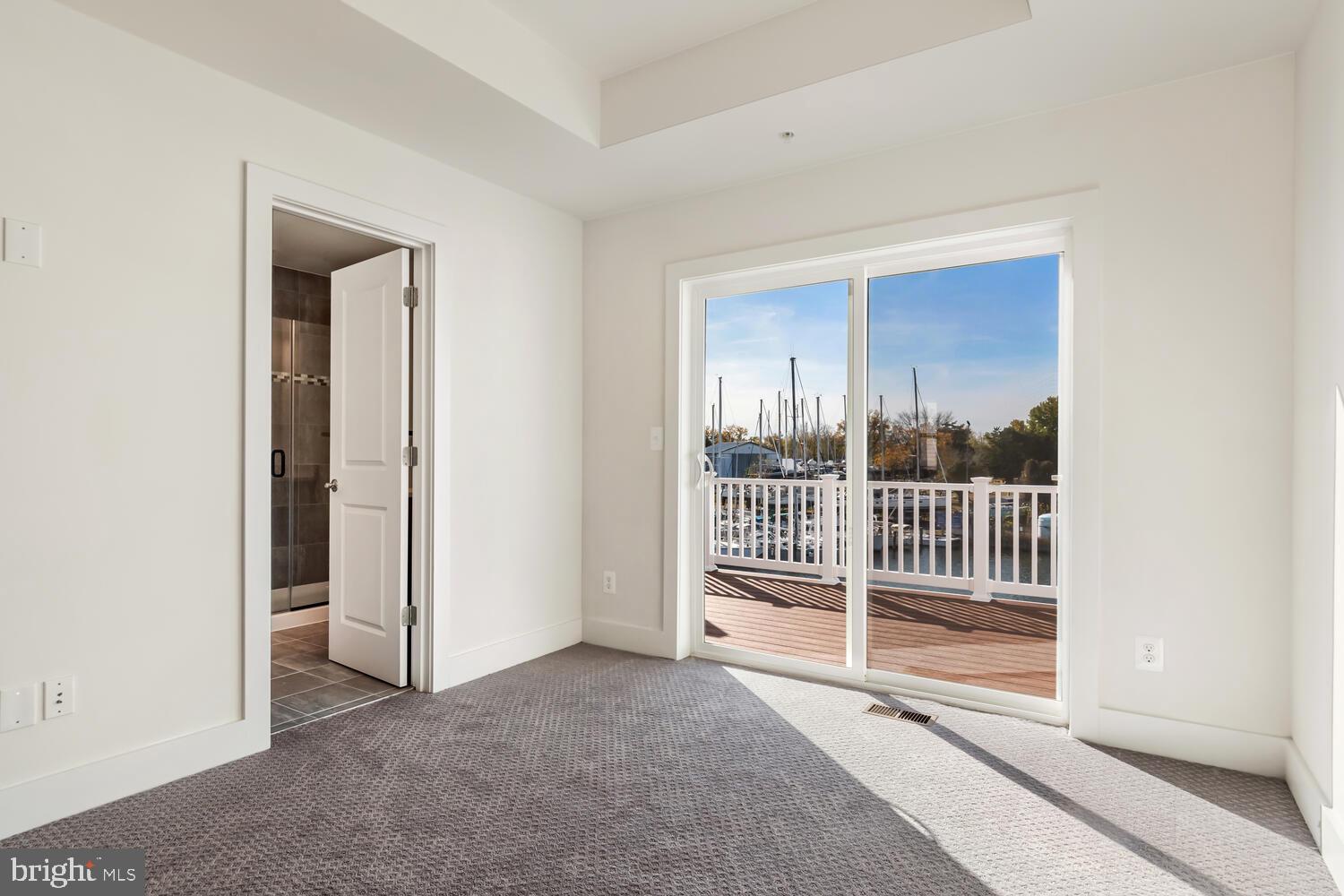 34 Riverside Drive Cambridge, MD 21613 - Photo 23 of 64 Primary suite with private deck access