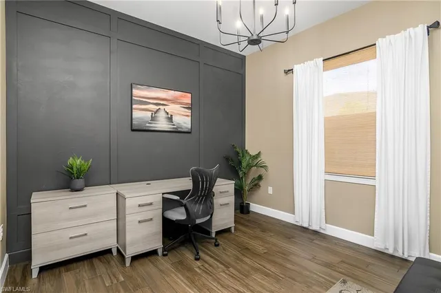 a workspace with furniture and window