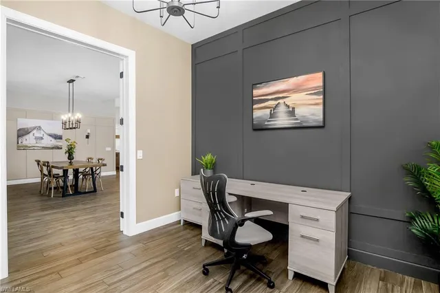 a work room with furniture and wooden floor