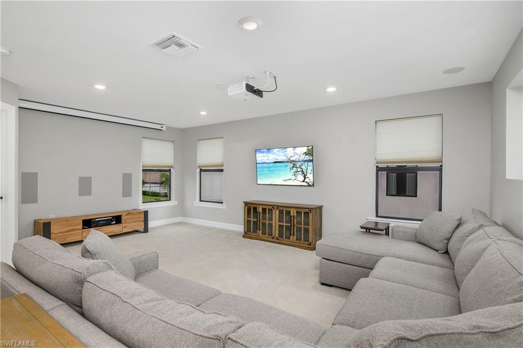 17570 Ashcomb Way Estero, FL 33928 - Photo 30 of 50 a living room with furniture and a couch