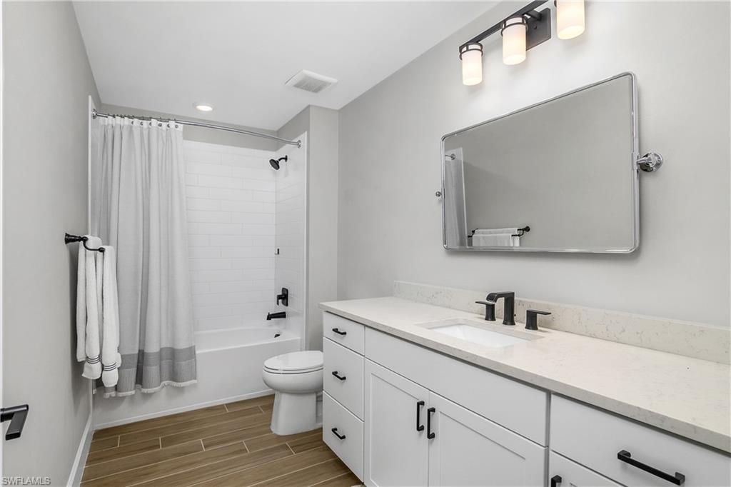 17570 Ashcomb Way Estero, FL 33928 - Photo 33 of 50 a bathroom with a sink a toilet and shower