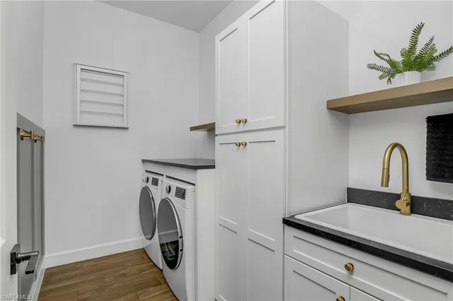 a view of storage and utility room with washer and dryer