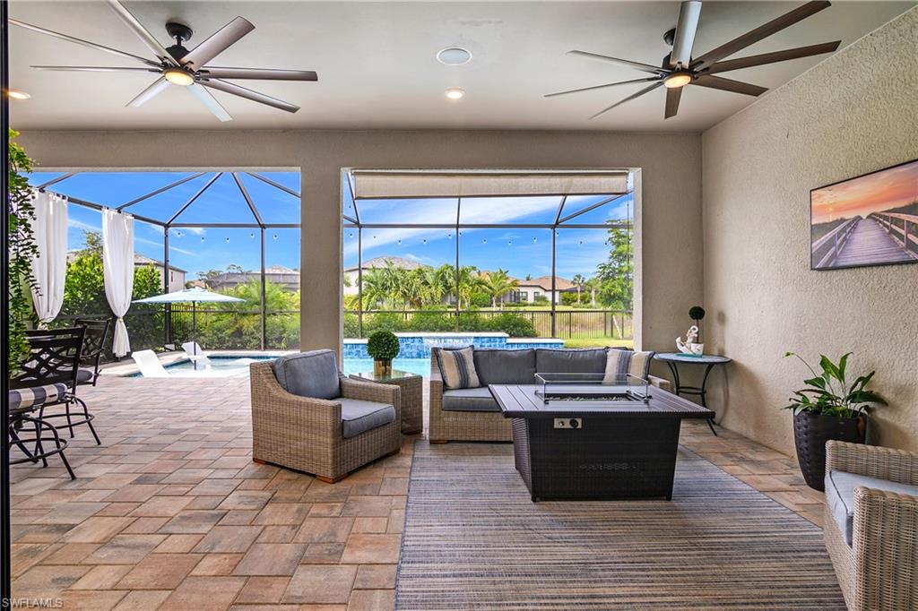 17570 Ashcomb Way Estero, FL 33928 - Photo 37 of 50 a living room with furniture potted plant and a large window