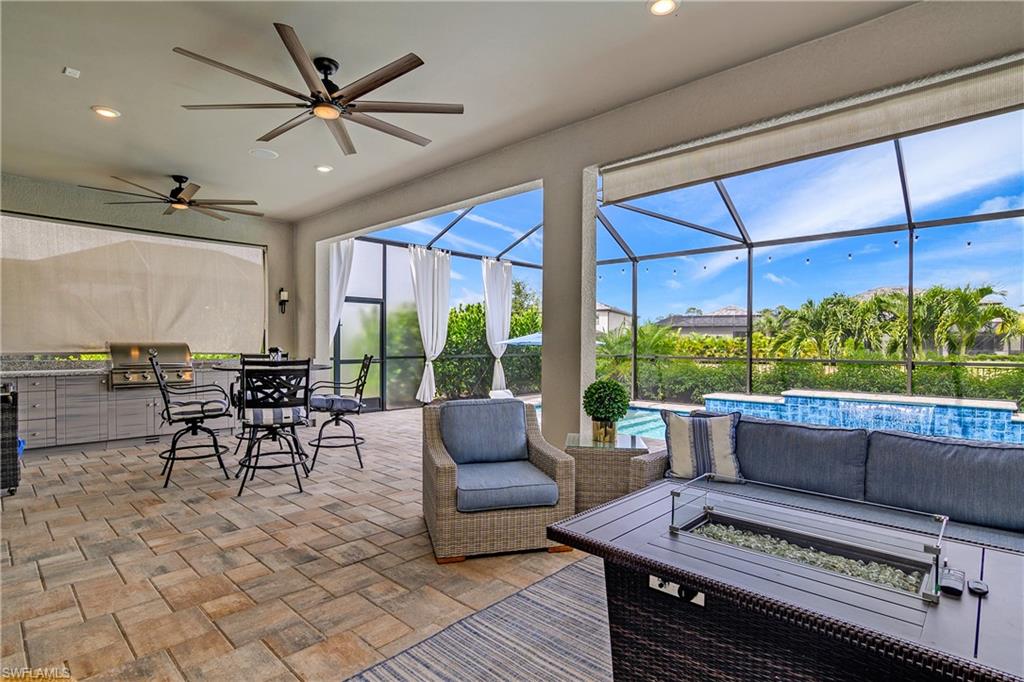 17570 Ashcomb Way Estero, FL 33928 - Photo 39 of 50 a living room with furniture and a large window