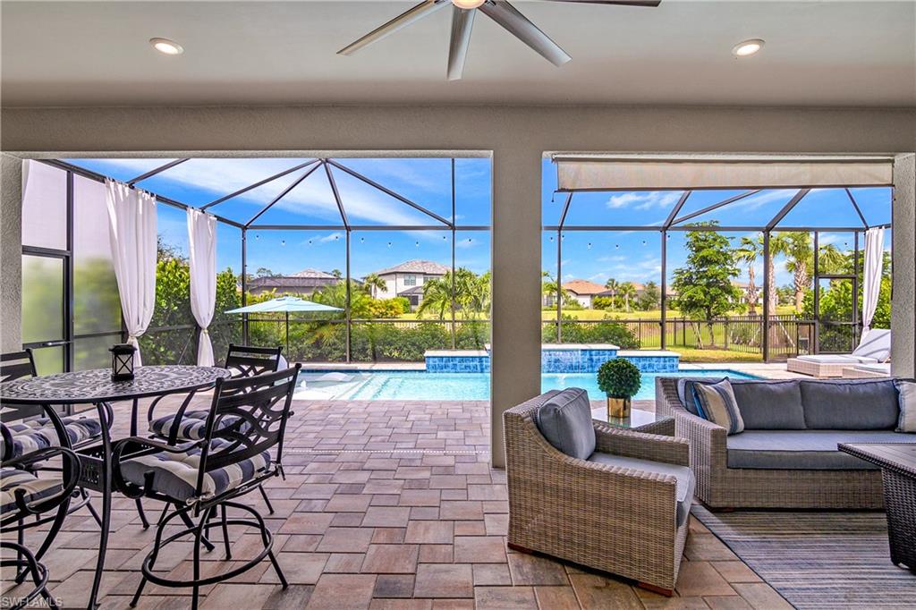17570 Ashcomb Way Estero, FL 33928 - Photo 41 of 50 a living room with furniture and a large window