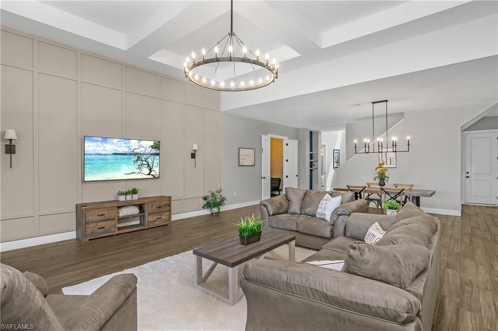 17570 Ashcomb Way Estero, FL 33928 - Photo 6 of 50 a living room with furniture chandelier and a chandelier