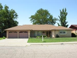 7203 Jameson Road Amarillo, TX 79106 - Photo 1 of 1 a front view of a house with a yard and garage