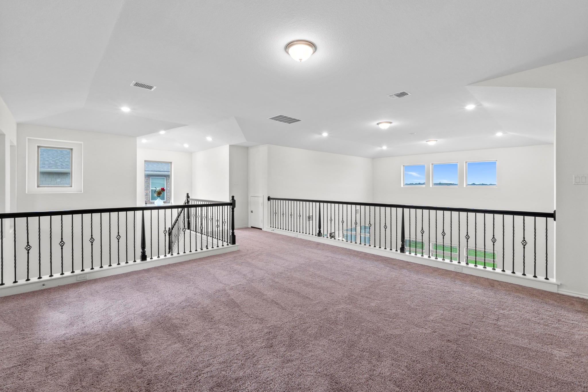 4729 San Rufo Drive Round Rock, TX 78665 - Photo 23 of 36 Expansive upper-level loft area with plush carpeting and crisp white walls
