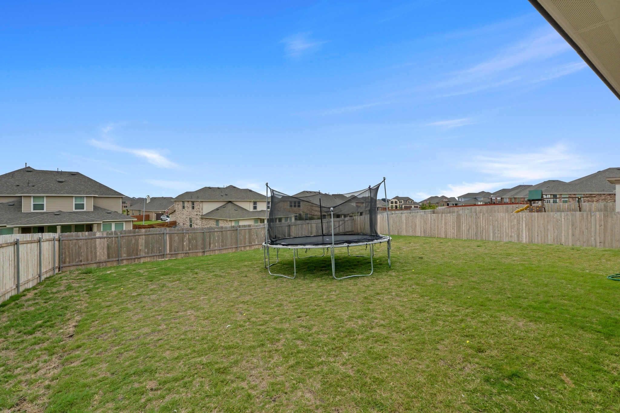 4729 San Rufo Drive Round Rock, TX 78665 - Photo 34 of 36 Spacious backyard featuring an expansive lawn and full privacy fencing
